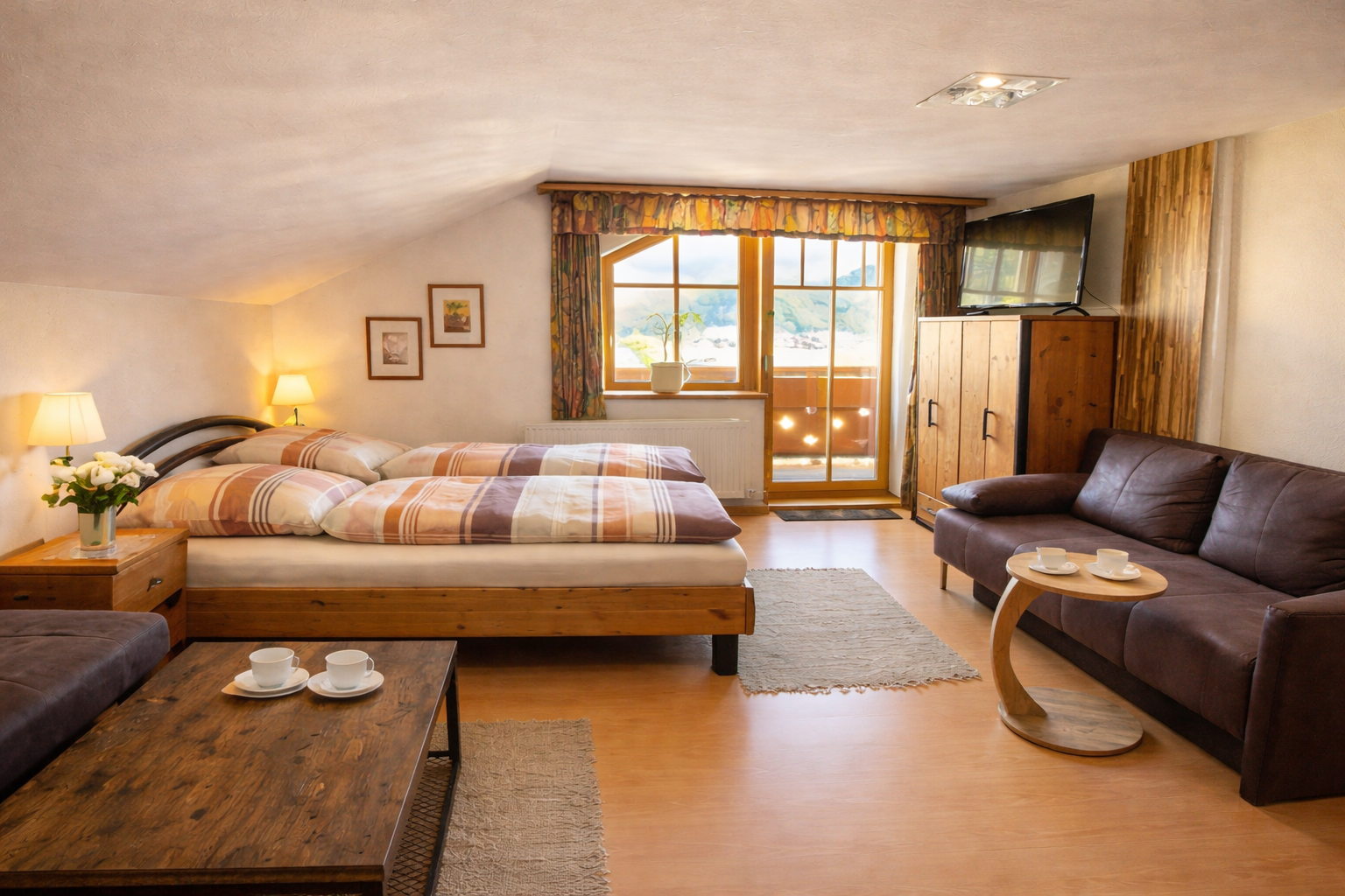 Helles Schlafzimmer mit Balkon und Sitzmöglichkeit im Appartement 5 im Landhaus am Hügel mit Doppelbett